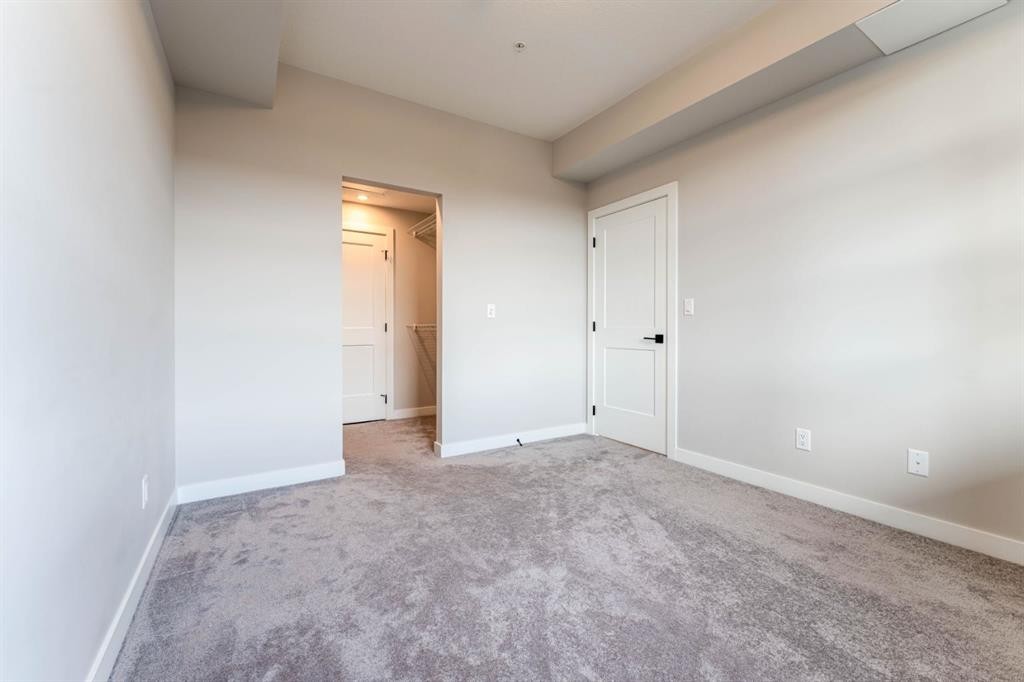 2312-55 Lucas Way Nw, Calgary, AB - Indoor Photo Showing Other Room