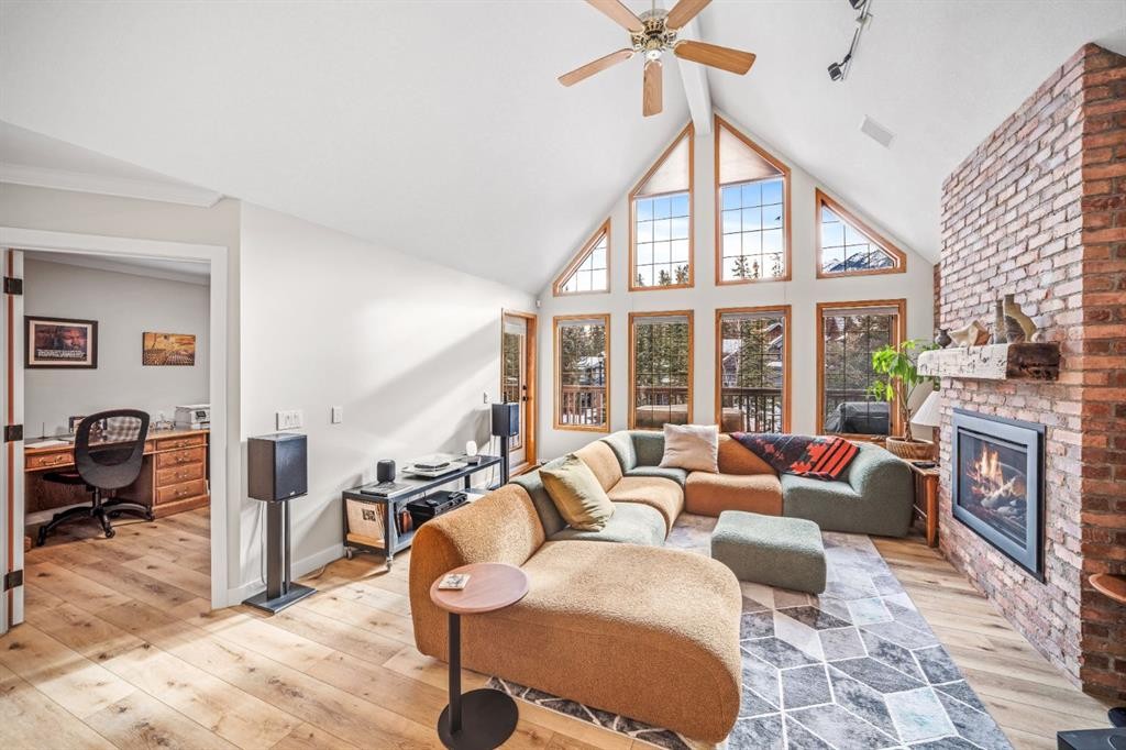 108 Lougheed Circle, Banff, AB - Indoor Photo Showing Living Room With Fireplace