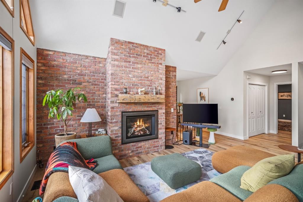 108 Lougheed Circle, Banff, AB - Indoor Photo Showing Living Room With Fireplace