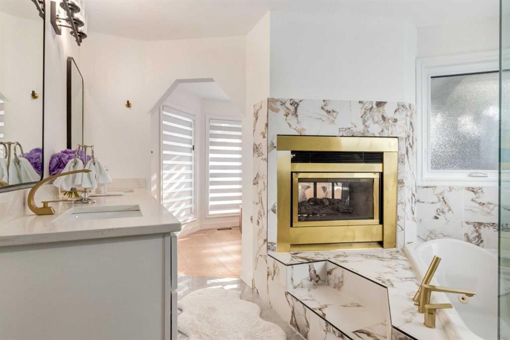 113 Straddock Terrace Sw, Calgary, AB - Indoor Photo Showing Living Room With Fireplace