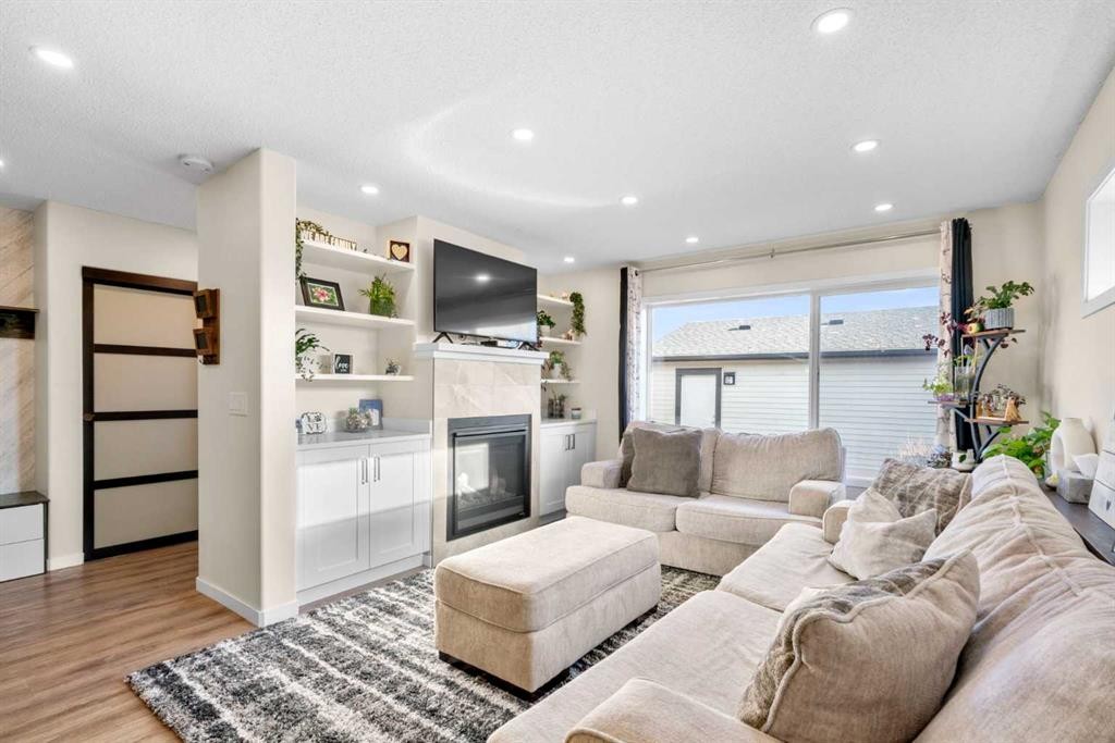 17 Cranford Place Se, Calgary, AB - Indoor Photo Showing Living Room With Fireplace