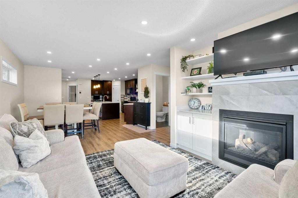 17 Cranford Place Se, Calgary, AB - Indoor Photo Showing Living Room With Fireplace