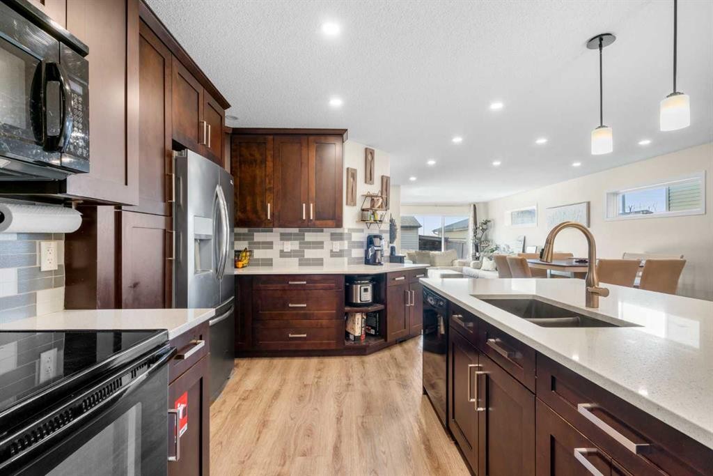 17 Cranford Place Se, Calgary, AB - Indoor Photo Showing Kitchen With Double Sink With Upgraded Kitchen