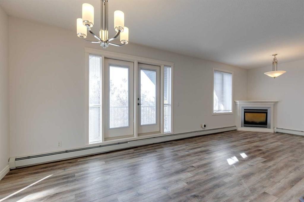 304-1606 4 Street Nw, Calgary, AB - Indoor Photo Showing Living Room With Fireplace