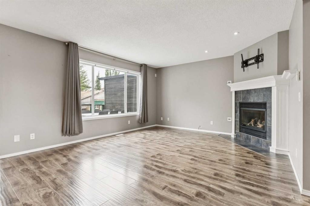 132 Citadel Meadow Bay Nw, Calgary, AB - Indoor Photo Showing Other Room With Fireplace