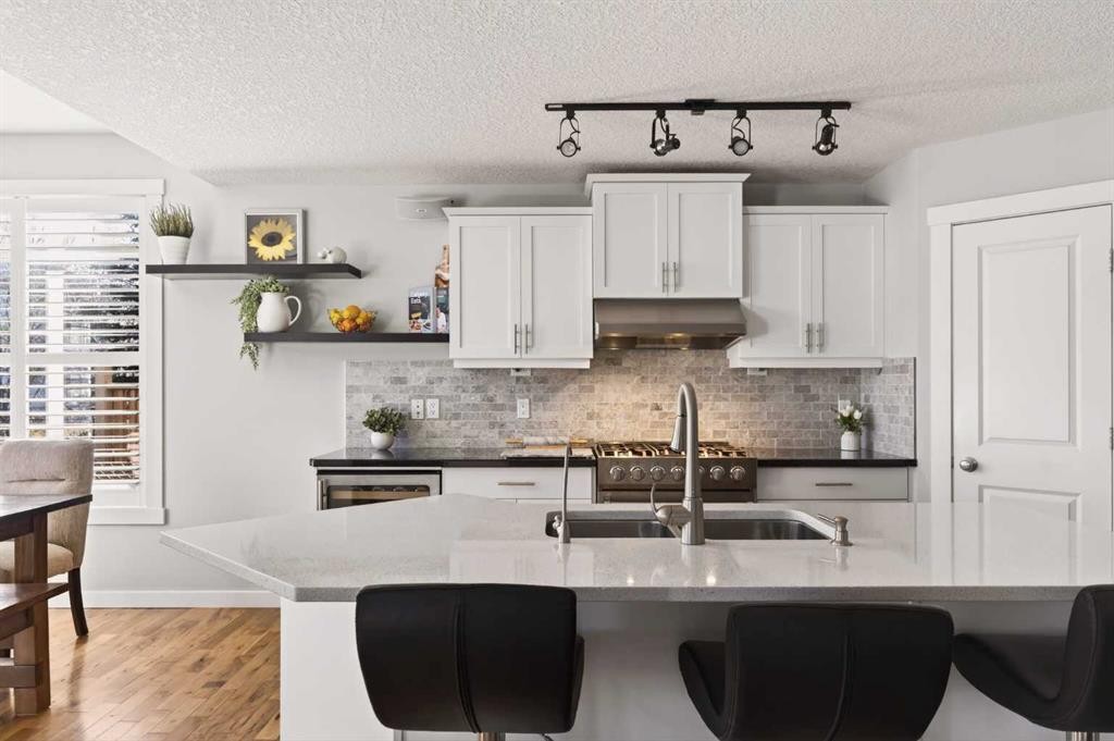 4 Cougarstone Square Sw, Calgary, AB - Indoor Photo Showing Kitchen With Double Sink With Upgraded Kitchen