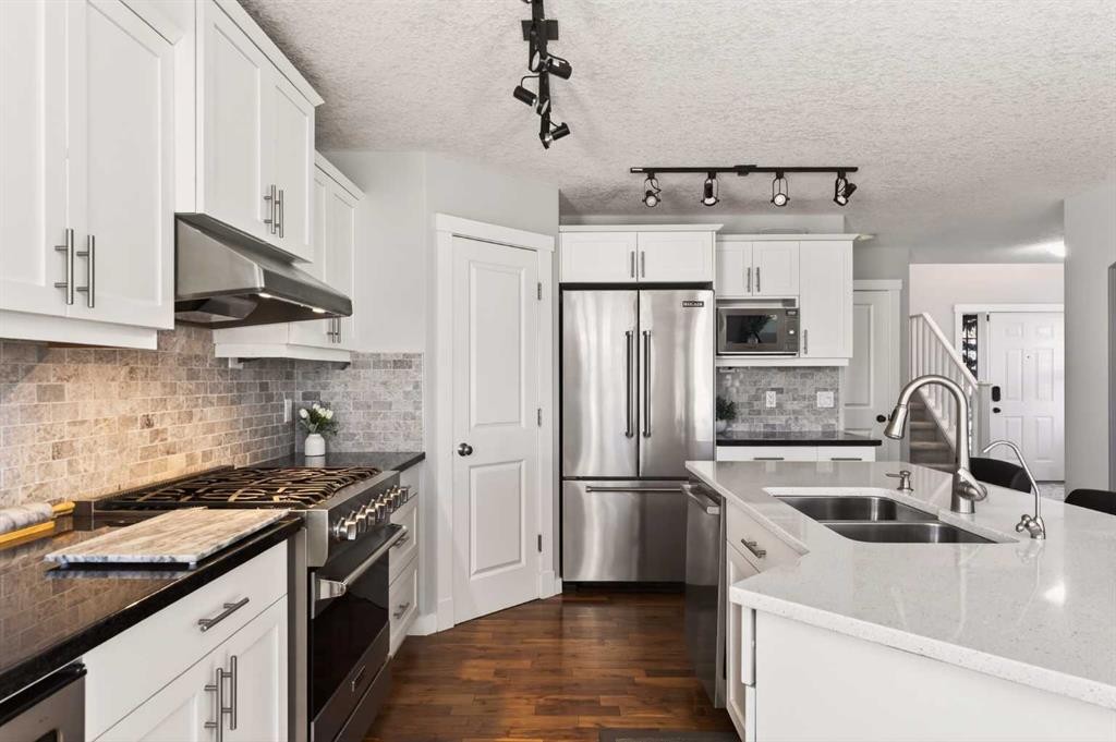 4 Cougarstone Square Sw, Calgary, AB - Indoor Photo Showing Kitchen With Stainless Steel Kitchen With Double Sink With Upgraded Kitchen