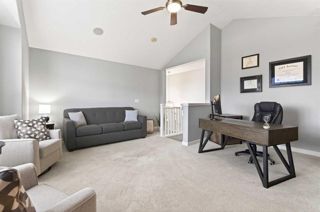 4 Cougarstone Square Sw, Calgary, AB - Indoor Photo Showing Living Room
