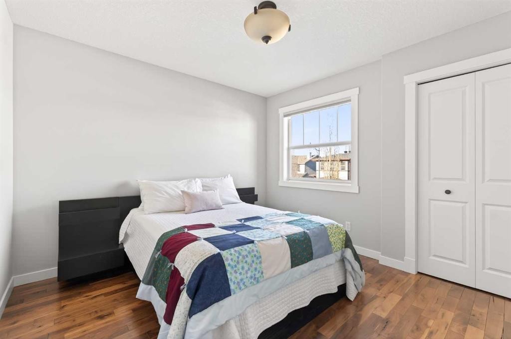 4 Cougarstone Square Sw, Calgary, AB - Indoor Photo Showing Bedroom