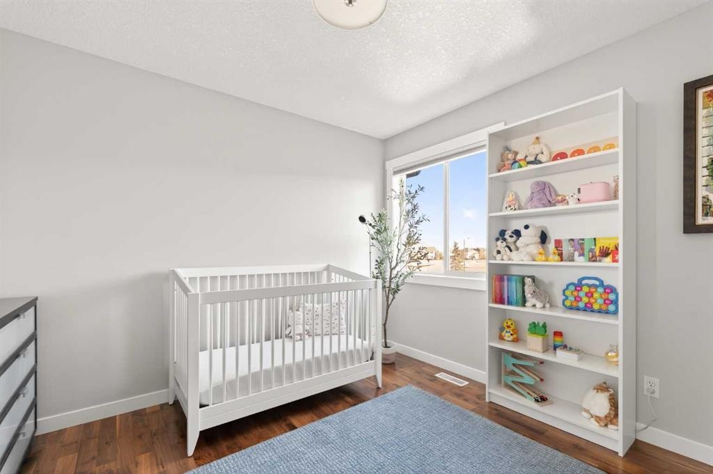 4 Cougarstone Square Sw, Calgary, AB - Indoor Photo Showing Bedroom