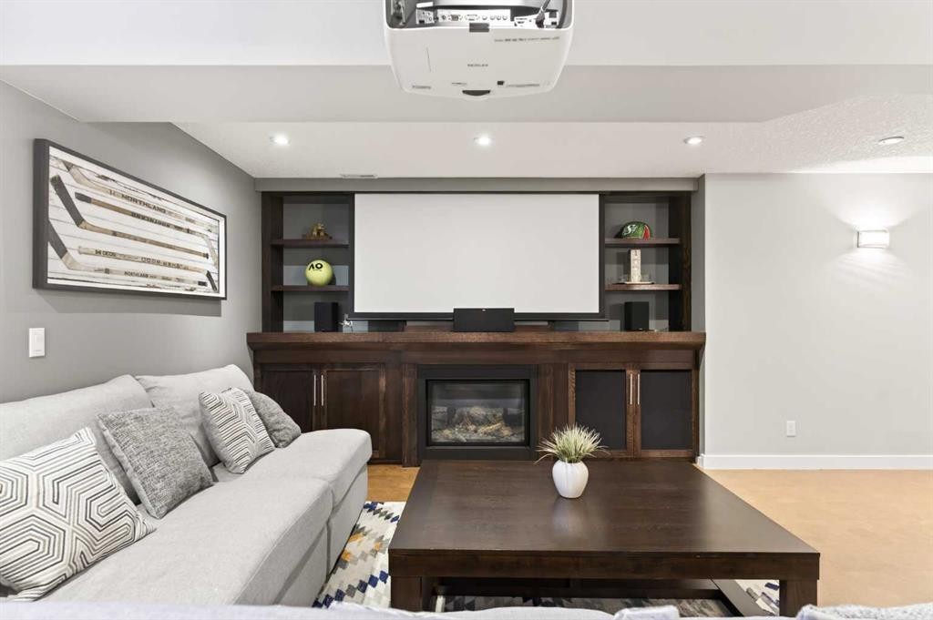 4 Cougarstone Square Sw, Calgary, AB - Indoor With Fireplace