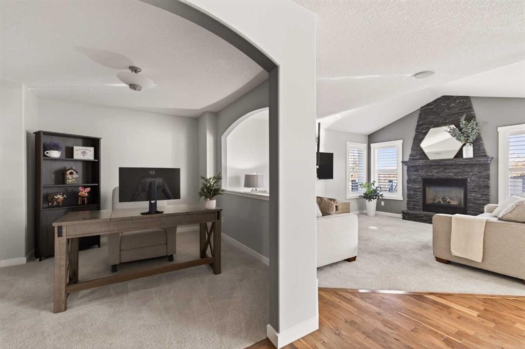 4 Cougarstone Square Sw, Calgary, AB - Indoor With Fireplace
