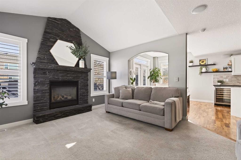 4 Cougarstone Square Sw, Calgary, AB - Indoor Photo Showing Living Room With Fireplace