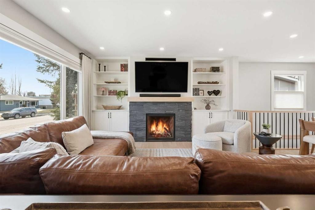 8615 7 Street Sw, Calgary, AB - Indoor Photo Showing Living Room With Fireplace