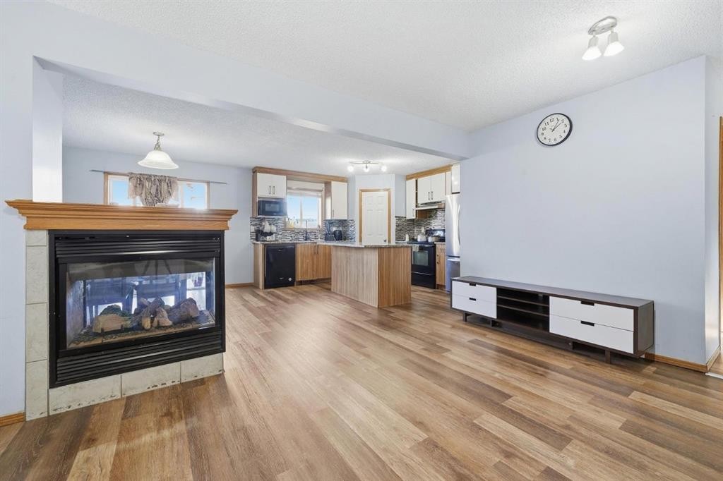 218 Tarawood Place Ne, Calgary, AB - Indoor Photo Showing Living Room With Fireplace