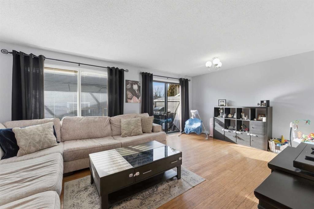 96 Abberfield Crescent Ne, Calgary, AB - Indoor Photo Showing Living Room