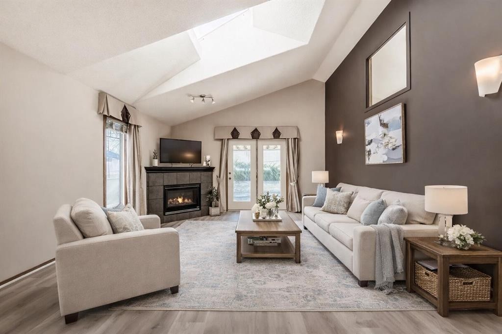 110 Somerglen Road Sw, Calgary, AB - Indoor Photo Showing Living Room With Fireplace