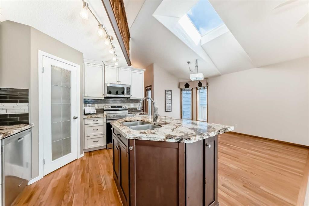 110 Somerglen Road Sw, Calgary, AB - Indoor Photo Showing Kitchen With Double Sink With Upgraded Kitchen