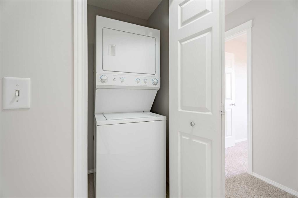 122 Panamount Drive Nw, Calgary, AB - Indoor Photo Showing Laundry Room