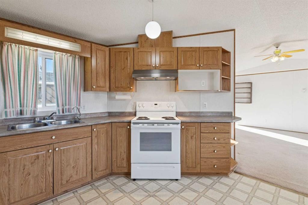 1909 29 Avenue, Nanton, AB - Indoor Photo Showing Kitchen With Double Sink