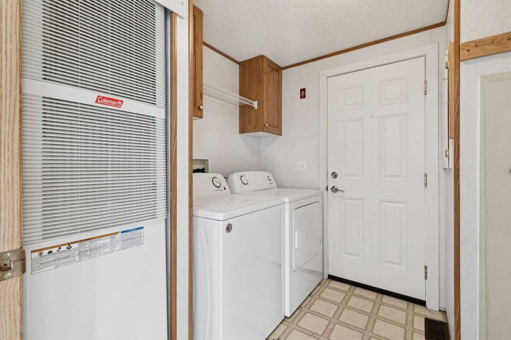1909 29 Avenue, Nanton, AB - Indoor Photo Showing Laundry Room