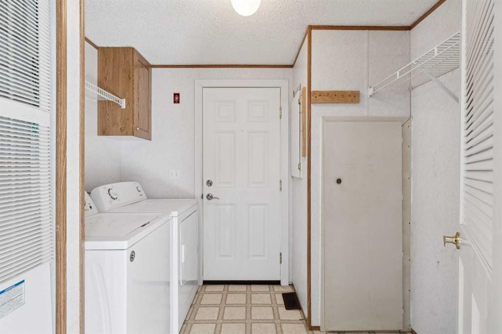 1909 29 Avenue, Nanton, AB - Indoor Photo Showing Laundry Room
