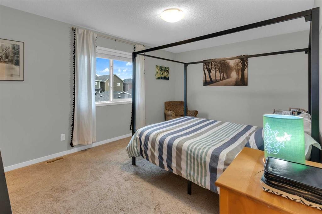 367 Fireside Place, Cochrane, AB - Indoor Photo Showing Bedroom