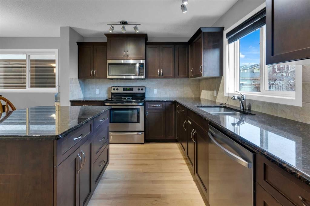 367 Fireside Place, Cochrane, AB - Indoor Photo Showing Kitchen With Stainless Steel Kitchen With Double Sink