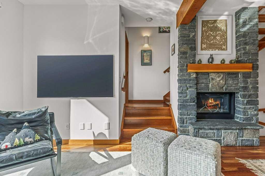 4-511 6Th Avenue, Canmore, AB - Indoor Photo Showing Living Room With Fireplace