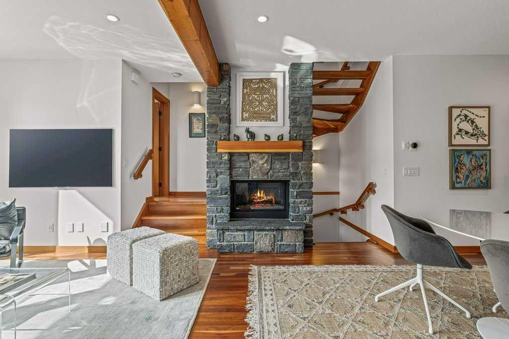 4-511 6Th Avenue, Canmore, AB - Indoor Photo Showing Living Room With Fireplace