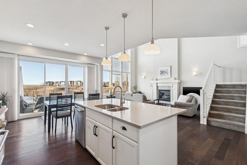 101 Cranarch Common Se, Calgary, AB - Indoor Photo Showing Kitchen With Fireplace With Double Sink