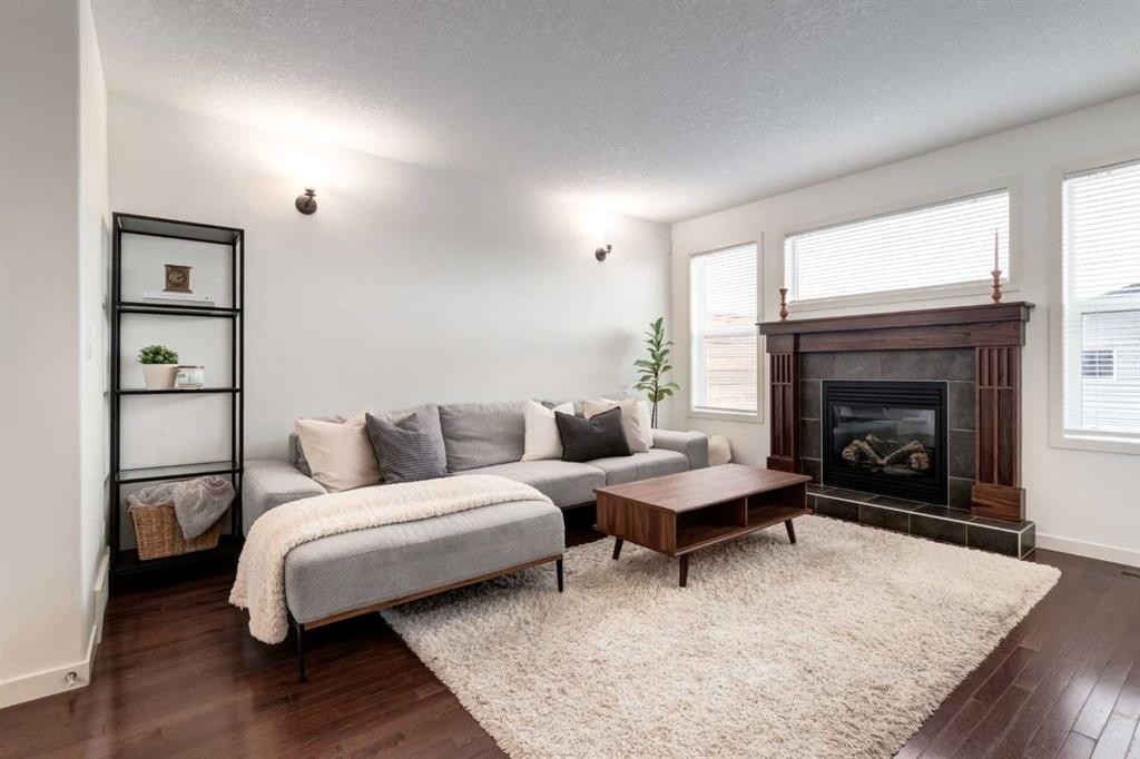 5 Cranford Place Se, Calgary, AB - Indoor Photo Showing Living Room With Fireplace