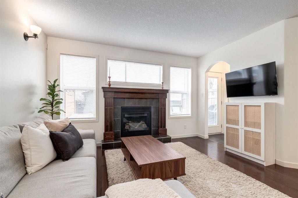 5 Cranford Place Se, Calgary, AB - Indoor Photo Showing Living Room With Fireplace
