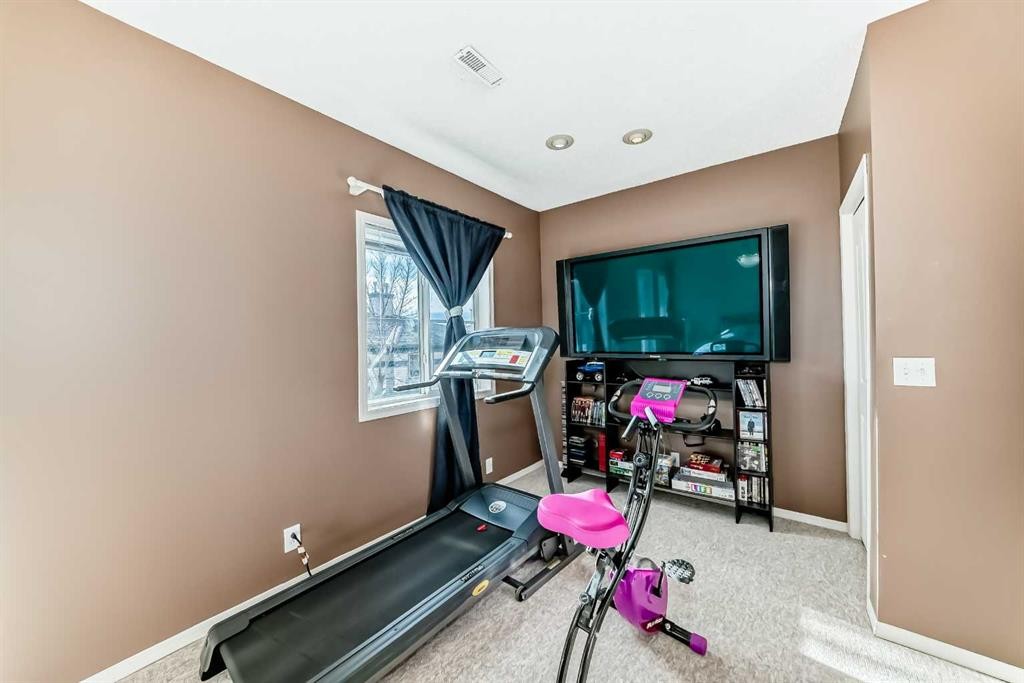 116 Hidden Creek Rise Nw, Calgary, AB - Indoor Photo Showing Gym Room
