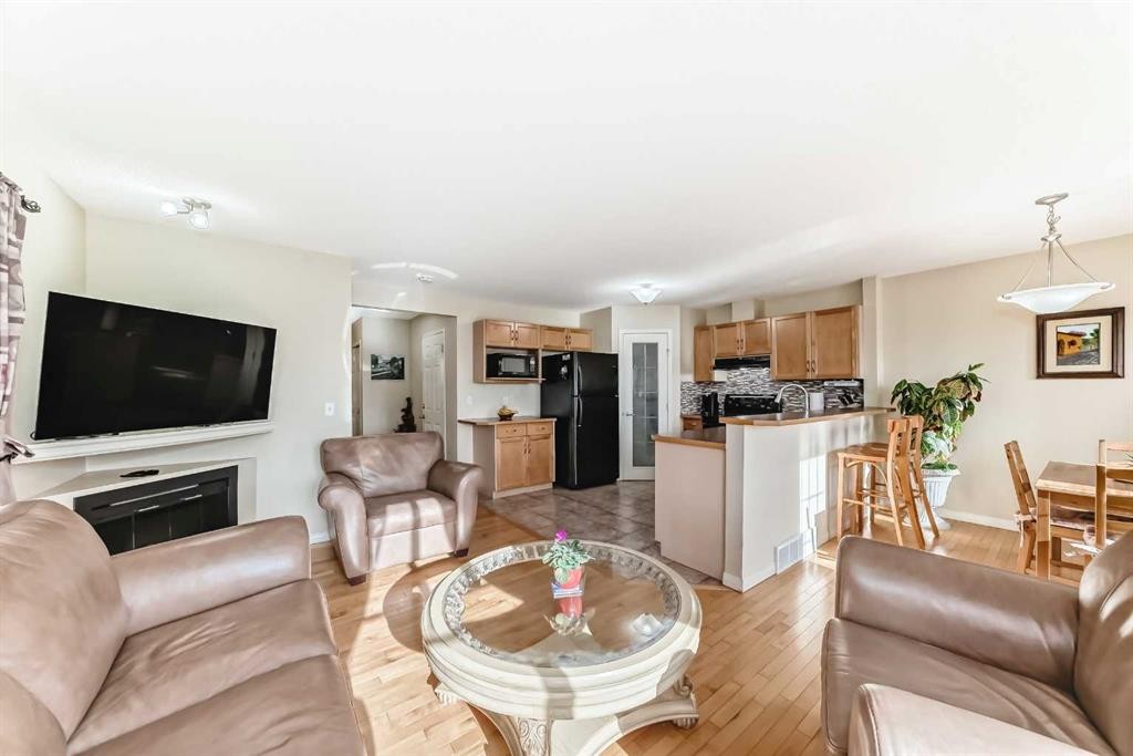 116 Hidden Creek Rise Nw, Calgary, AB - Indoor Photo Showing Living Room With Fireplace