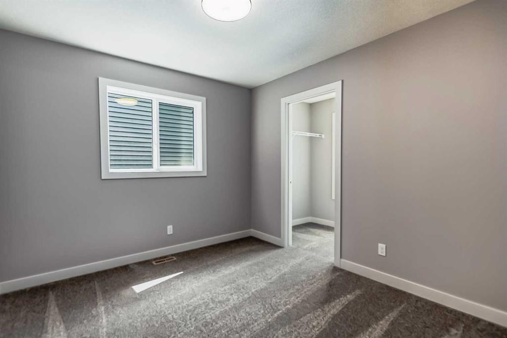 4 Topaz Place, Cochrane, AB - Indoor Photo Showing Other Room