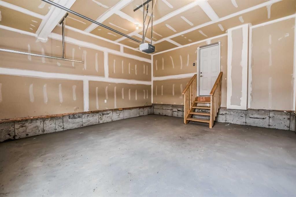 4 Topaz Place, Cochrane, AB - Indoor Photo Showing Garage