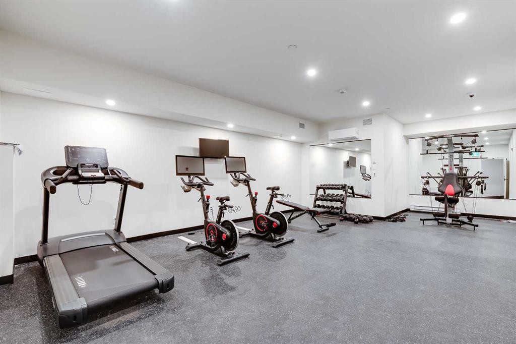 1414-520 Reynolds Avenue Sw, Airdrie, AB - Indoor Photo Showing Gym Room