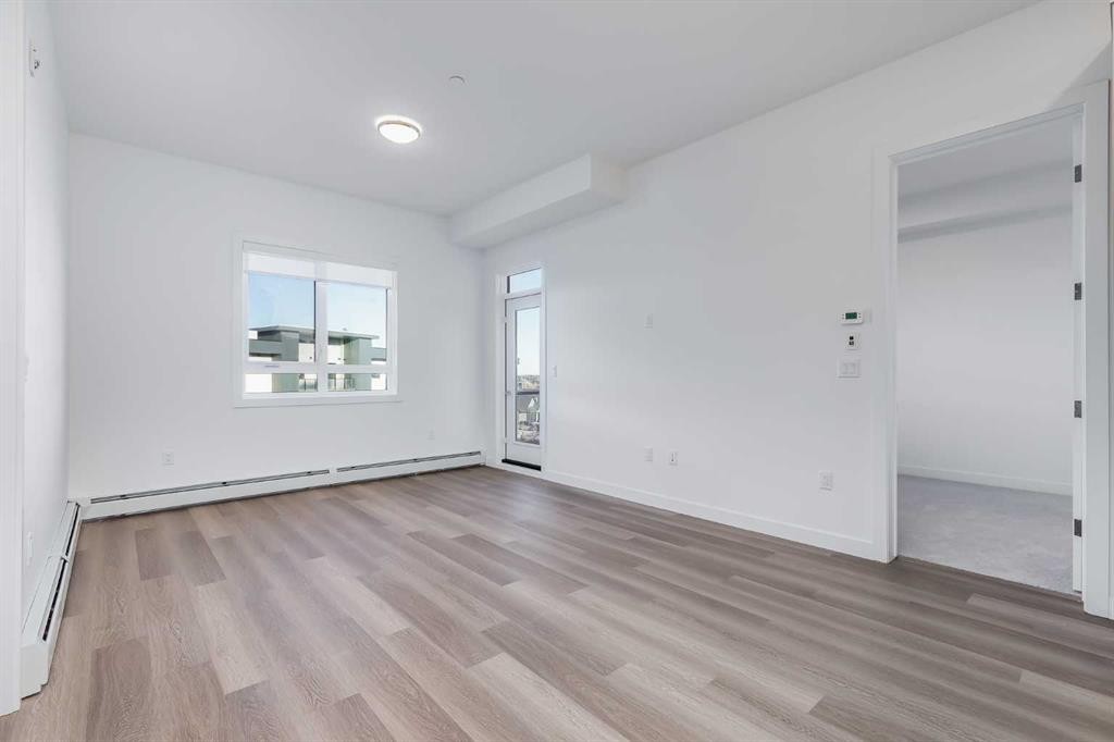 1414-520 Reynolds Avenue Sw, Airdrie, AB - Indoor Photo Showing Other Room