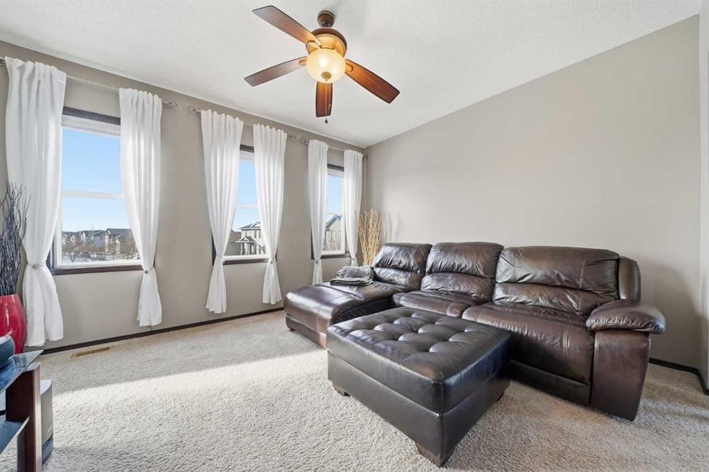 65 Elgin Meadows Circle Se, Calgary, AB - Indoor Photo Showing Living Room