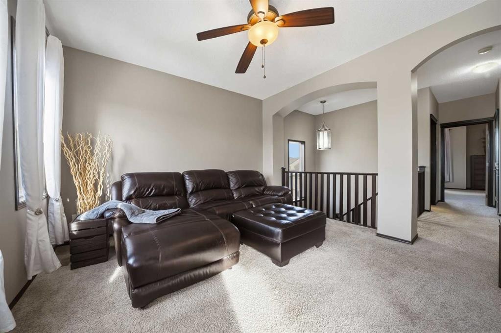 65 Elgin Meadows Circle Se, Calgary, AB - Indoor Photo Showing Living Room