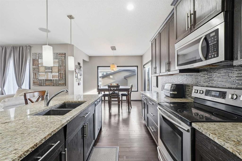 65 Elgin Meadows Circle Se, Calgary, AB - Indoor Photo Showing Kitchen With Stainless Steel Kitchen With Double Sink With Upgraded Kitchen
