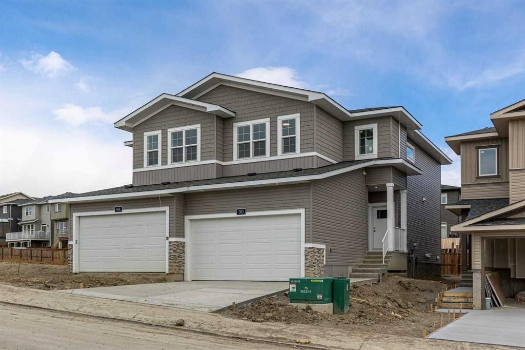 90 Heritage Circle, Cochrane, AB - Outdoor With Facade