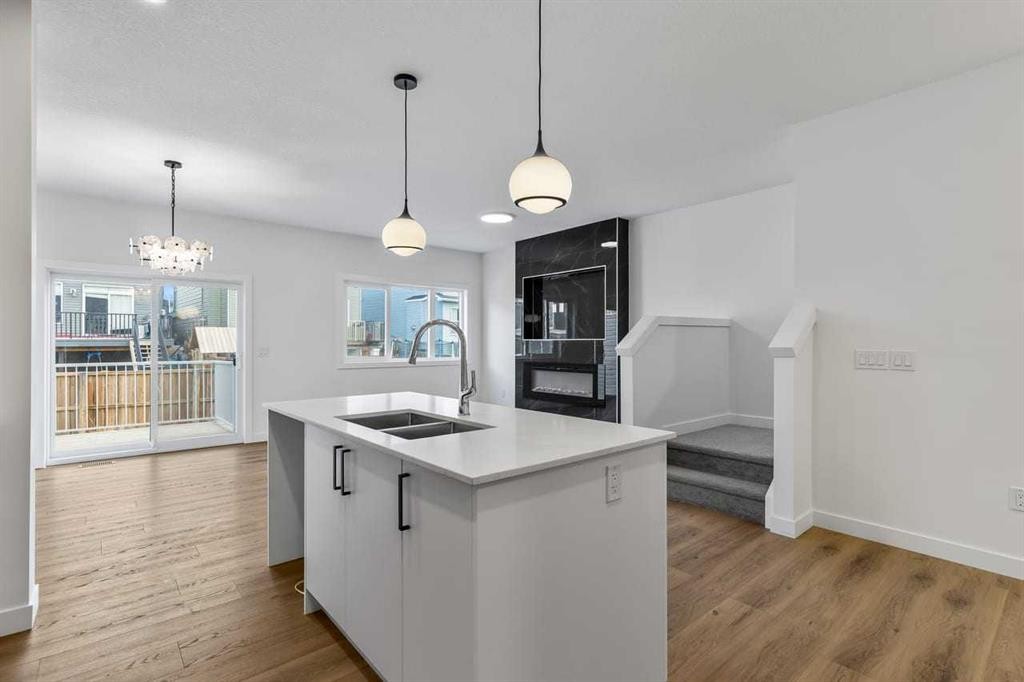90 Heritage Circle, Cochrane, AB - Indoor Photo Showing Kitchen With Double Sink With Upgraded Kitchen