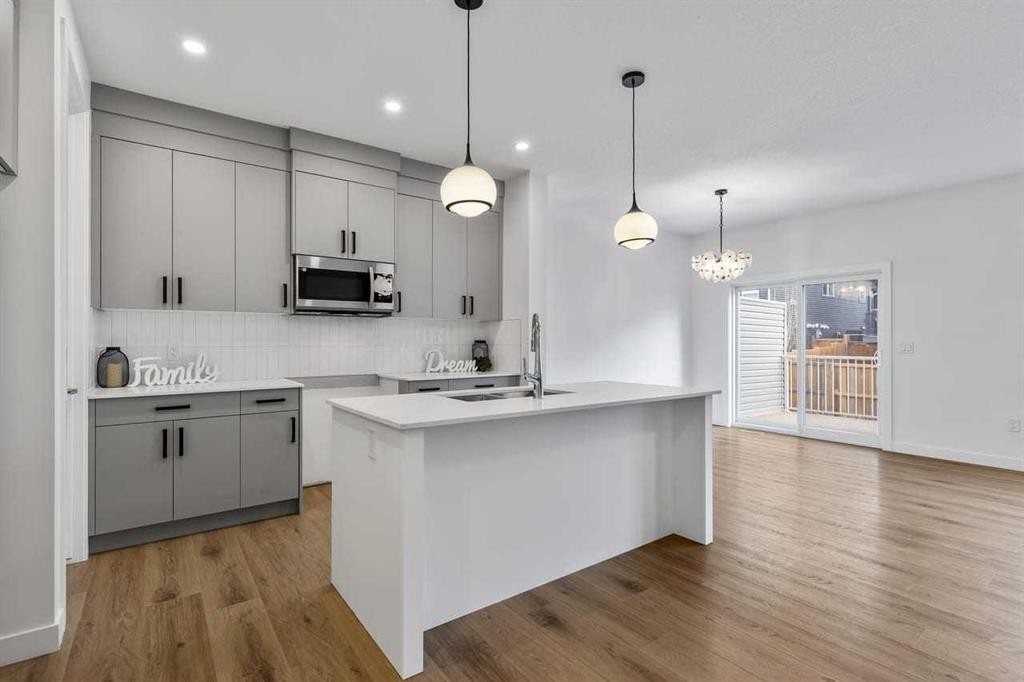 90 Heritage Circle, Cochrane, AB - Indoor Photo Showing Kitchen With Upgraded Kitchen