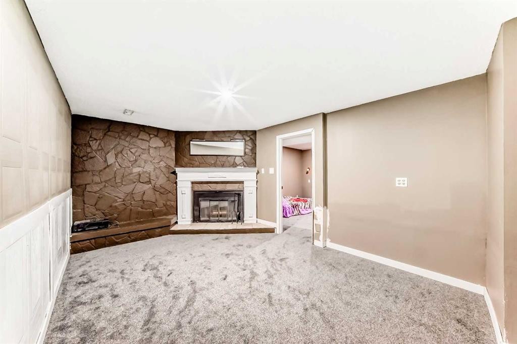 707 Malvern Drive Ne, Calgary, AB - Indoor With Fireplace