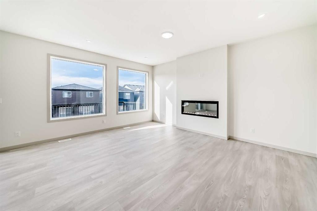 31 Lucas Passage Nw, Calgary, AB - Indoor Photo Showing Living Room With Fireplace