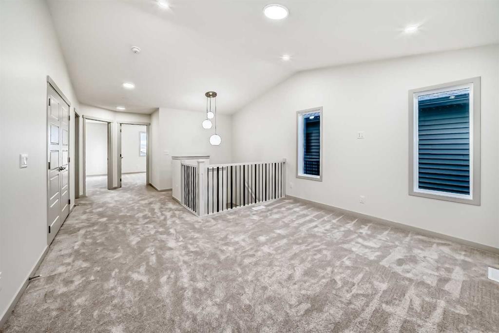 31 Lucas Passage Nw, Calgary, AB - Indoor Photo Showing Other Room