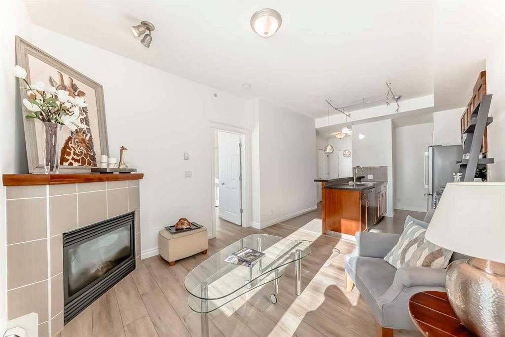 3217-24 Hemlock Crescent Sw, Calgary, AB - Indoor Photo Showing Living Room With Fireplace