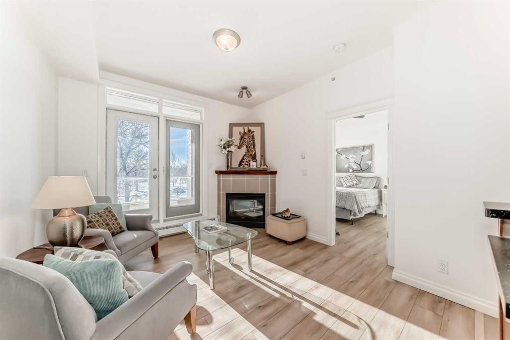 3217-24 Hemlock Crescent Sw, Calgary, AB - Indoor Photo Showing Living Room With Fireplace